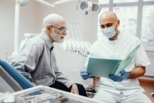 old man sitting dentist s office